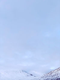 Scenic view of snow covered mountain against sky