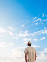 Rear view of person against sky