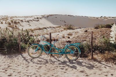 Bicycle on sand at desert