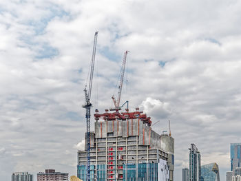 Modern buildings in city against sky