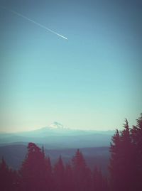 Scenic view of mountains against clear blue sky