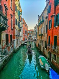 Canal passing through city buildings