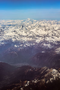 Scenic view of snowcapped mountains against sky