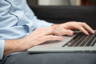 Close-up of businessman using laptop