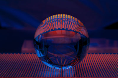 Close-up of illuminated lamp on table