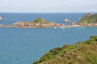 Scenic view of sea and buildings against sky