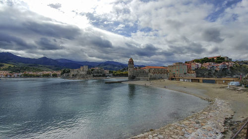 View of city against cloudy sky