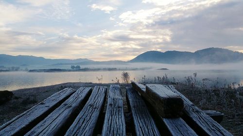 Scenic view of lake against sky during winter