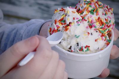 Child eating ice cream with sprinkles