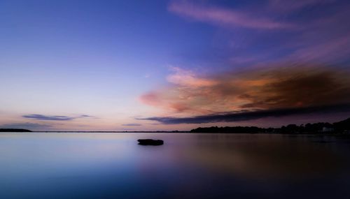 Scenic view of sea at sunset