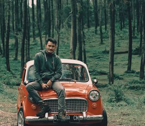 Portrait of smiling man in forest