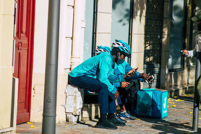 Men sitting on seat