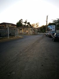 Road in city against clear sky