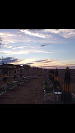 Scenic view of beach against sky during sunset