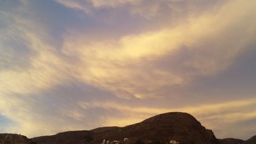 Scenic view of mountains against sky during sunset