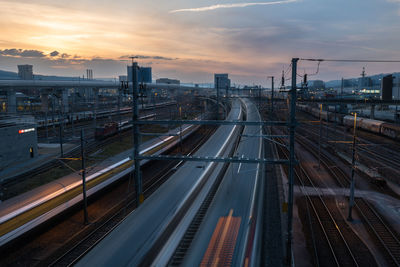 High angle view of railroad tracks against sky during sunset