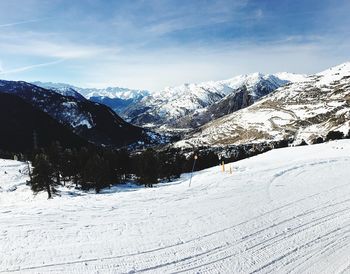 Snow covered mountains against sky