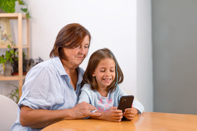 Young woman using laptop at home