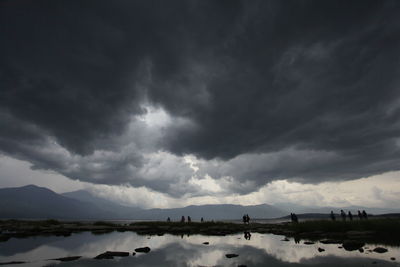 Scenic view of dramatic sky over lake