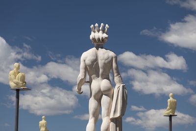 Low angle view of statue against sky