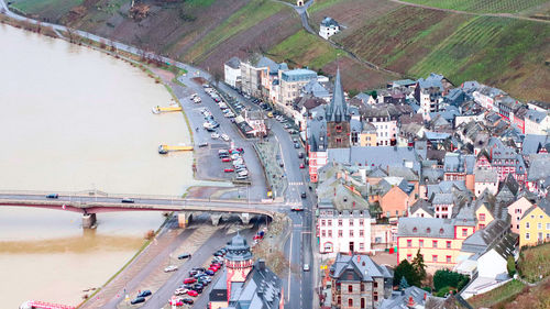 High angle view of road by buildings in city