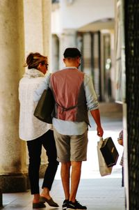 Rear view of couple walking outdoors