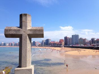 Panoramic view of sea and buildings against sky