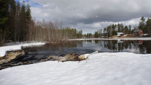 Scenic view of frozen lake against sky