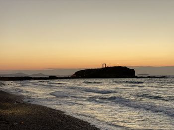 Scenic view of sea against clear sky during sunset