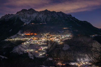 Snowy mountain village at night