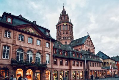 Low angle view of historic building against cloudy sky