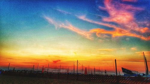 Scenic view of dramatic sky over sea during sunset