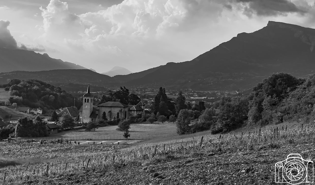 sky, mountain, architecture, built structure, building exterior, building, cloud - sky, nature, landscape, environment, scenics - nature, plant, beauty in nature, mountain range, land, field, no people, day, tranquil scene, tree, outdoors