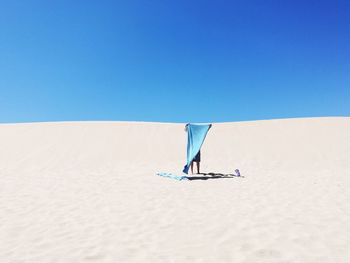 Scenic view of beach against clear sky