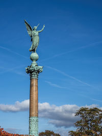 Low angle view of statue against sky.