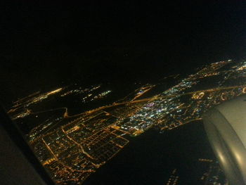 Aerial view of illuminated cityscape at night