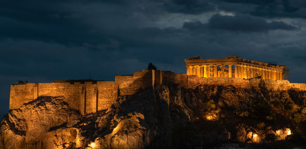 Historic building against sky at dusk