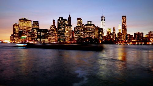 Illuminated buildings in city at night