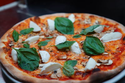 Close-up of pizza served on table