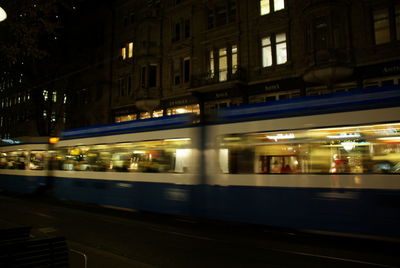 Light trails on illuminated city at night