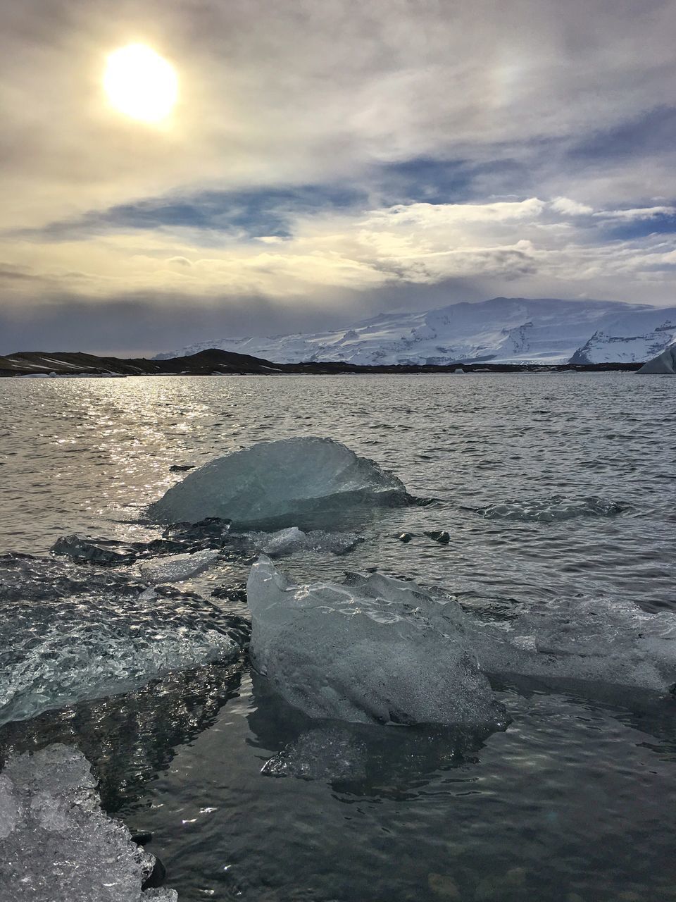 water, sea, sky, tranquil scene, scenics, tranquility, beauty in nature, cloud - sky, sun, beach, nature, reflection, horizon over water, shore, sunlight, idyllic, cloud, cloudy, sunset, waterfront