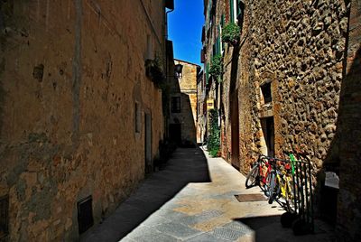 Alley amidst buildings against sky