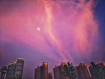 Panoramic view of buildings against sky at night