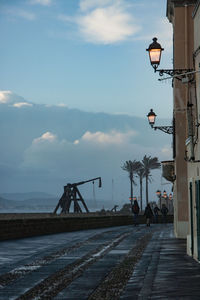 People on street against sky