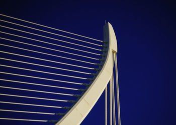 Low angle view of modern building against blue sky