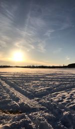 Scenic view of landscape against sky during sunset