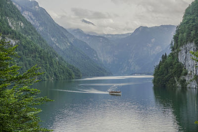 Scenic view of lake and mountains against sky