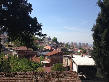 High angle view of townscape and trees against sky