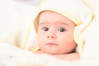 Cute baby girl in towel