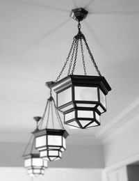 Low angle view of light fixture hanging from ceiling